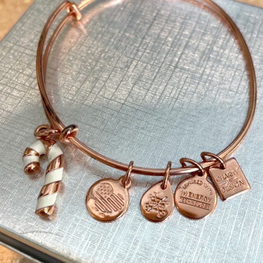 Alex and Ani rose gold Christmas bracelet with white striped candy cane charm